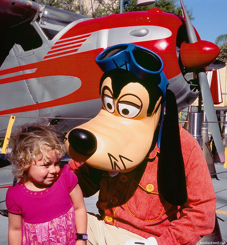 Katie gets goofy around Goofy at Disneyland