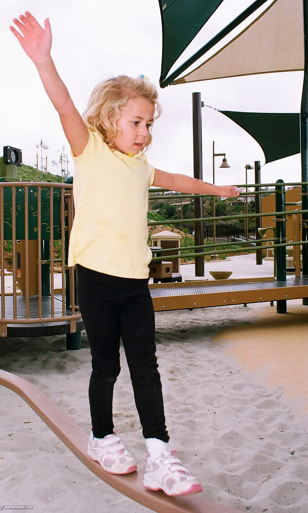 Katie on the balance bar at the new park. 
