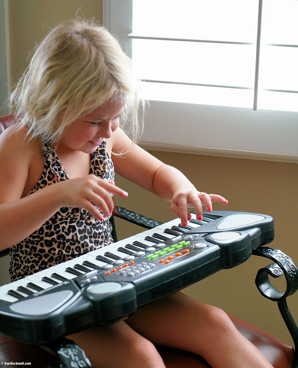 Katie plays keyboards in leopard print