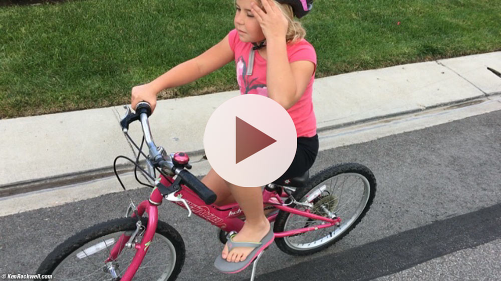 Katie learns to ride a two-wheelie bike for the first time