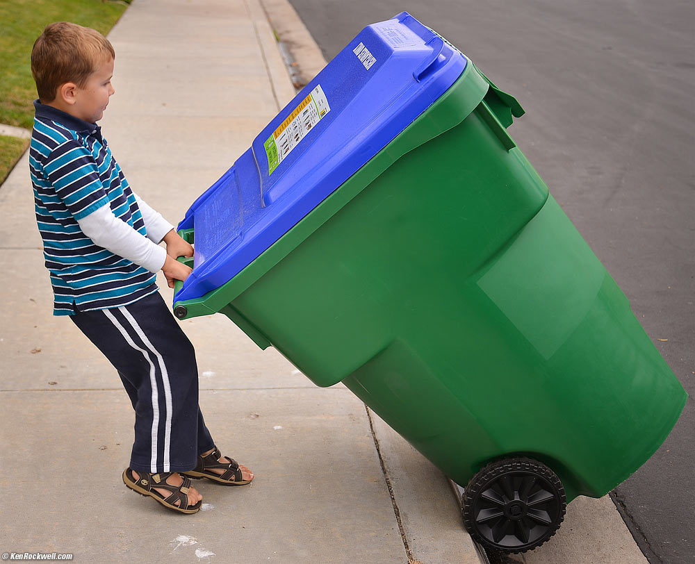 Ryan insists on pulling in the empty trash cans