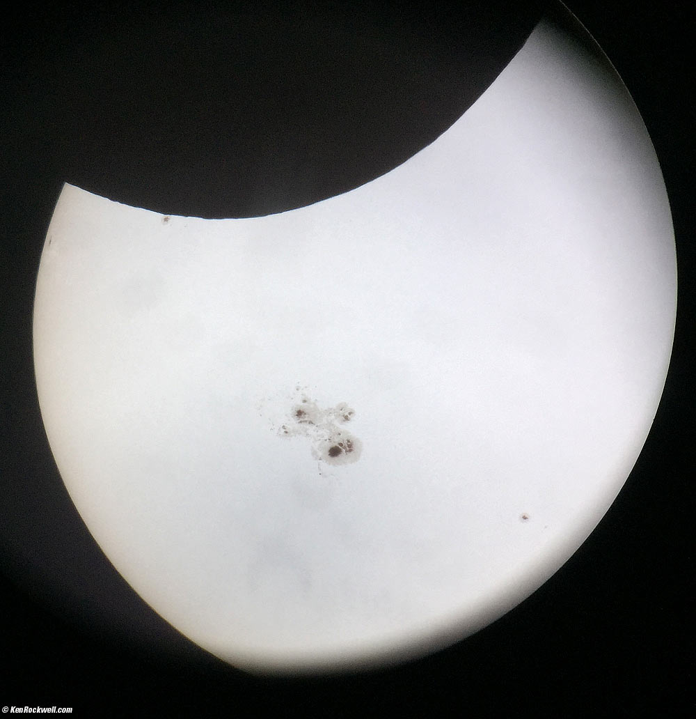 Solar Eclipse with huge sunspots, also showing surface textures of the moon