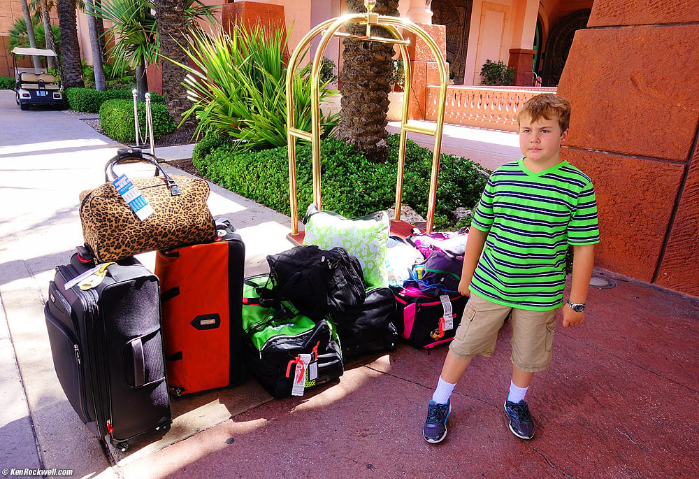 Ryan and our pile of luggage in front of the resort