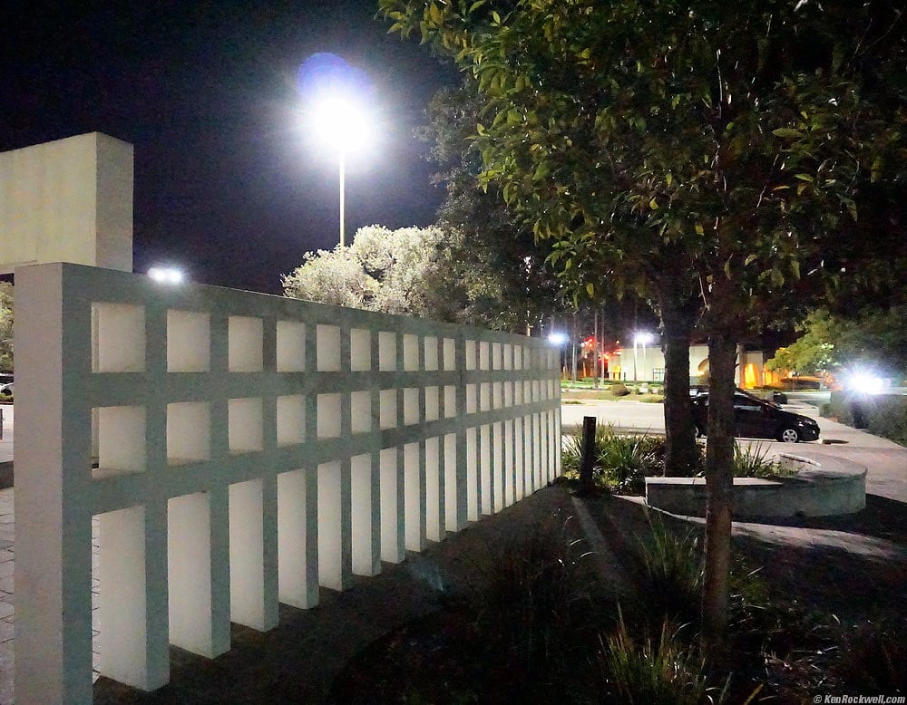 outside Carlsbad Dove library showing wall sculpture at night