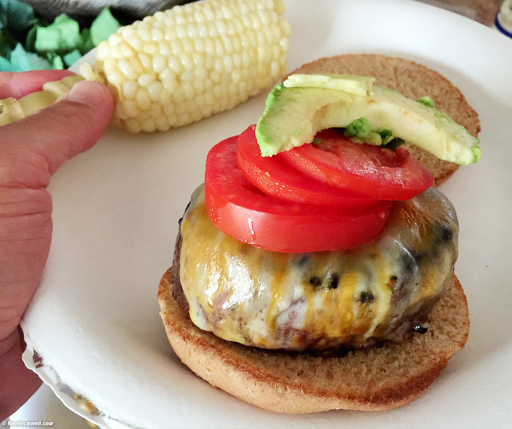Homemade BBQ Cheeseburger with tomatos and avocado