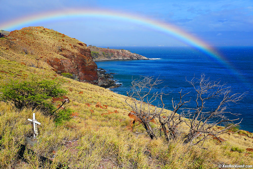 Vivid rainbow and cross, scenic overlook on Maui's west coast