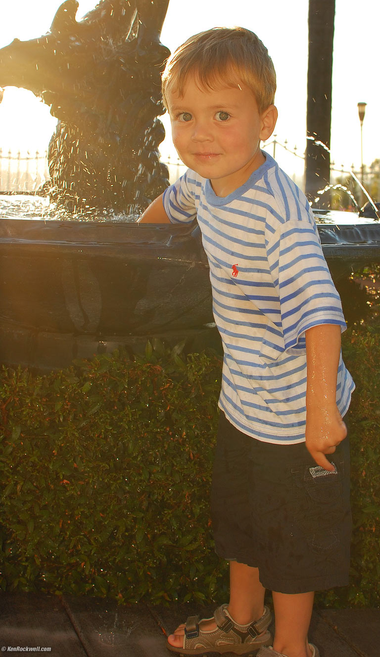 Ryan with His Hand in Noni's Fountain, 7:13 PM.