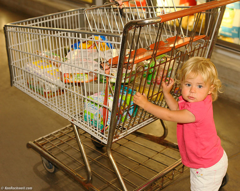 Katie pushes the cart, Costco, Maui. 12:36 PM.