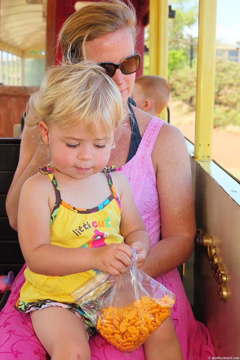 Katie enjoying num-num with Aunt Lisa on the Sugar Cane Train, Maui, 11:38 AM.