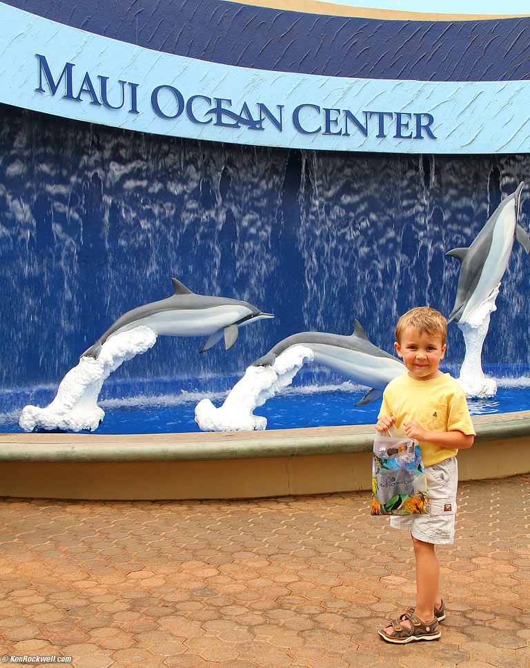 Ryan poses in front of the dolphins with his catch, 3:30 PM. 