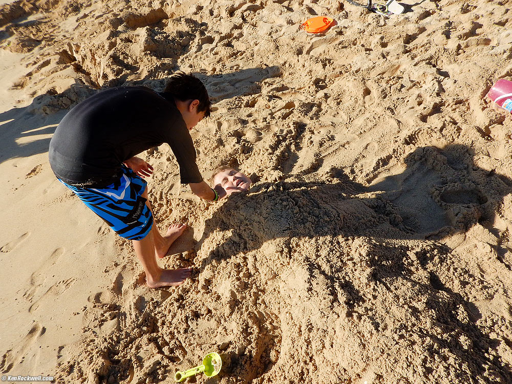 Ryan being buried in the sand